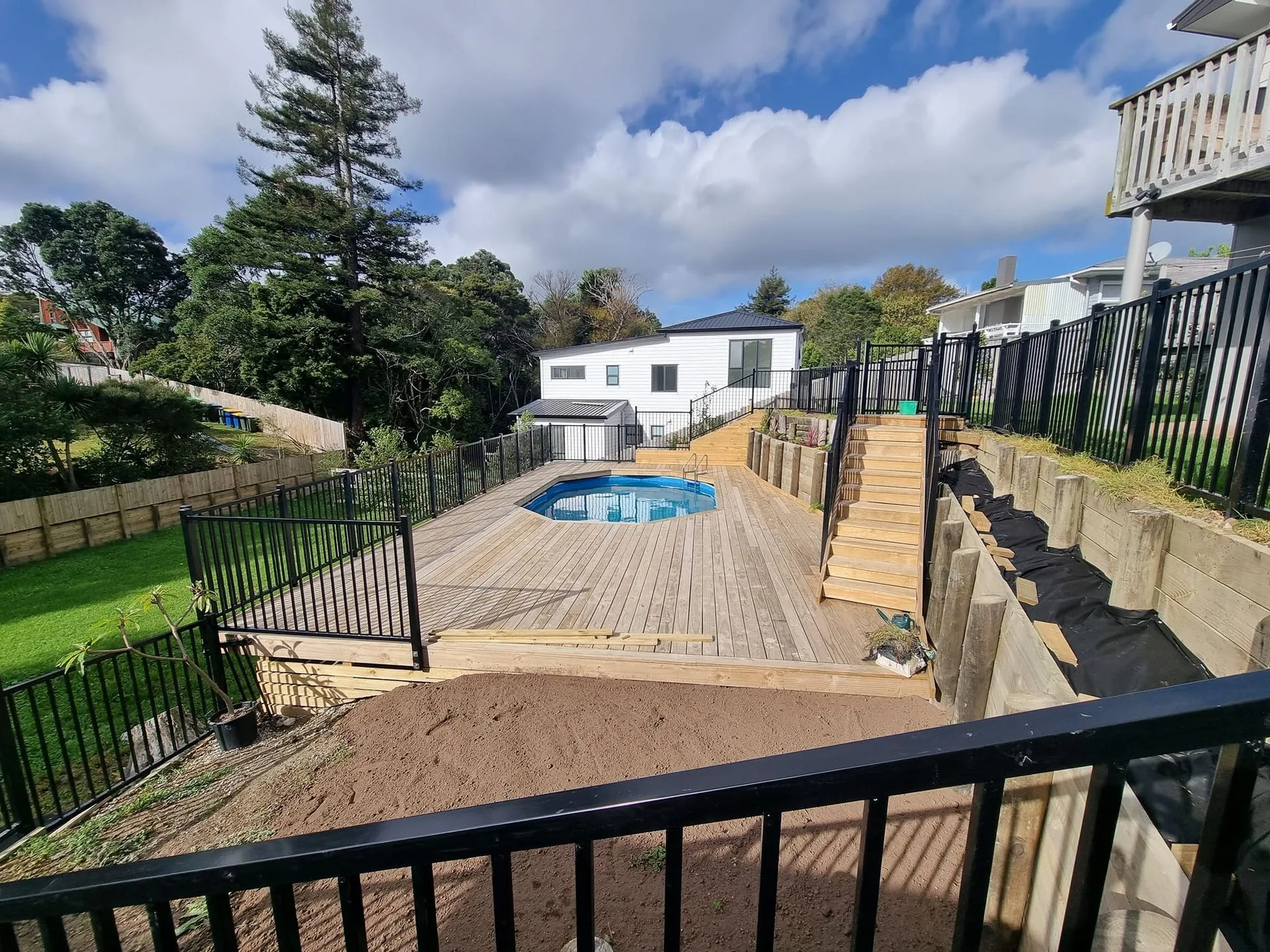 Completed Helium project showing retaining walls, decking and swimming pool