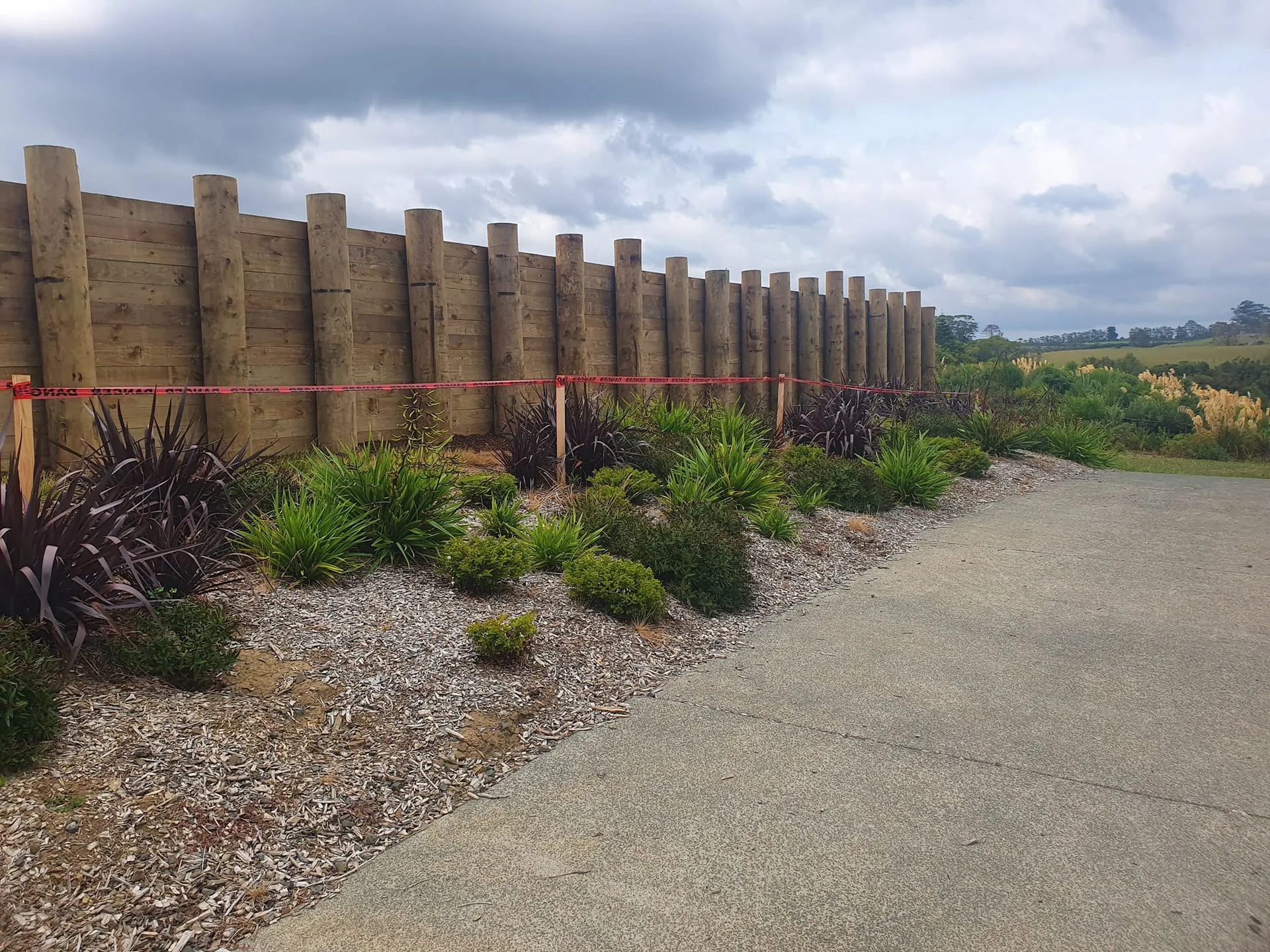 Timber pole retaining wall